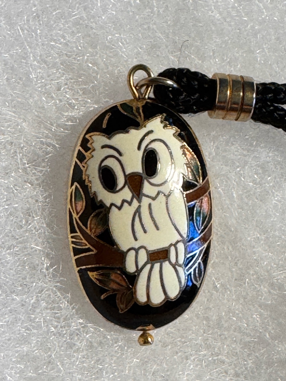 vintage black cord necklace with a detailed cloisonné pendant of a white owl